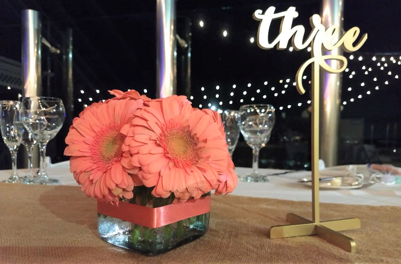 Gold Table Number With Gerber Daisies 