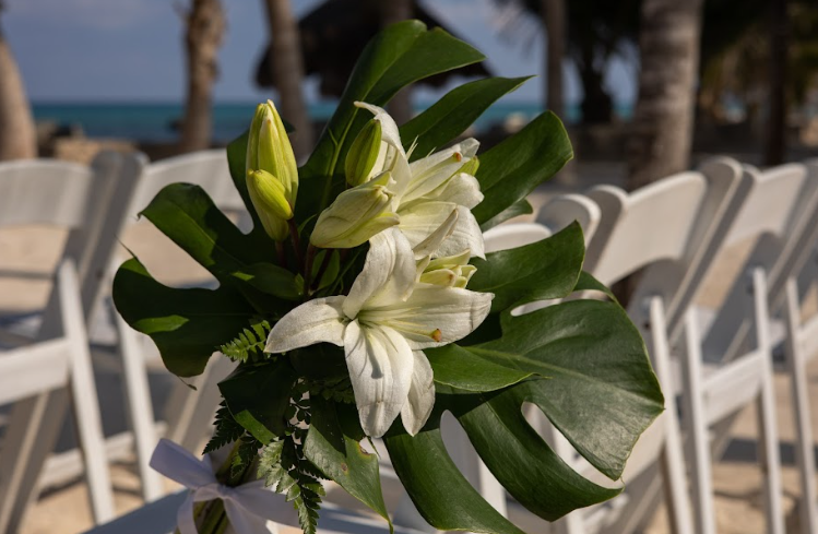 White Lilies And Monstera Chair Corsage.PNG